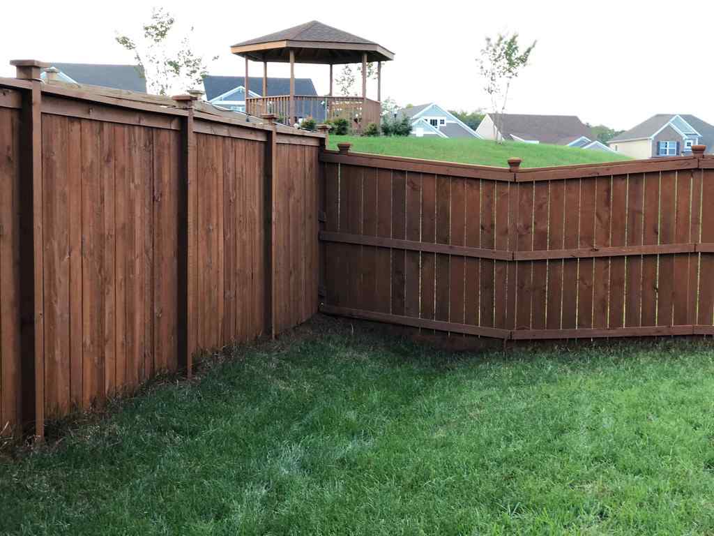 Photo of stained wood privacy fence
