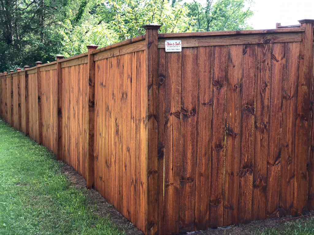 Photo of a beautifully stained wood privacy fence