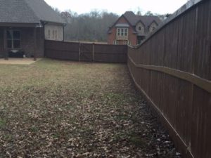 Photo of the interior of a privacy wood fenced in yard