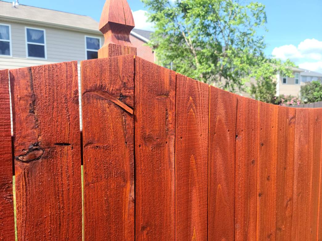 Photo of a stained wood fence